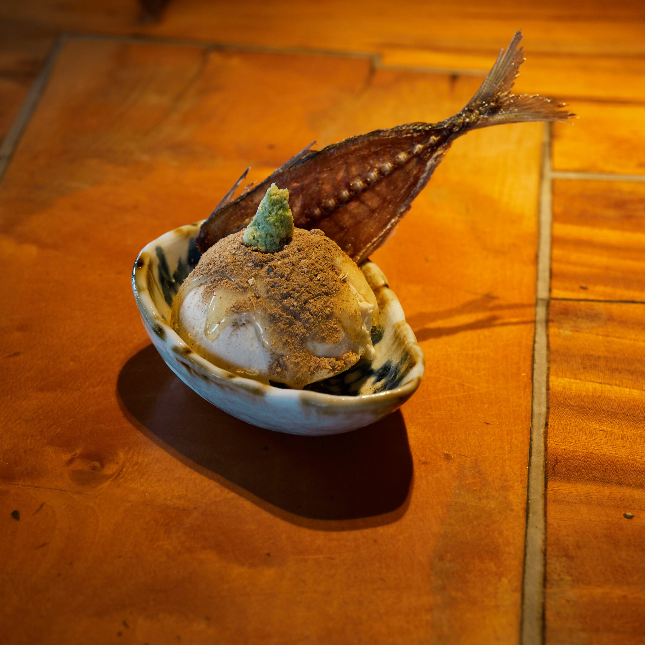 Vanilla Gyo-ice with fish powder, wasabi and a fish-bone cracker.