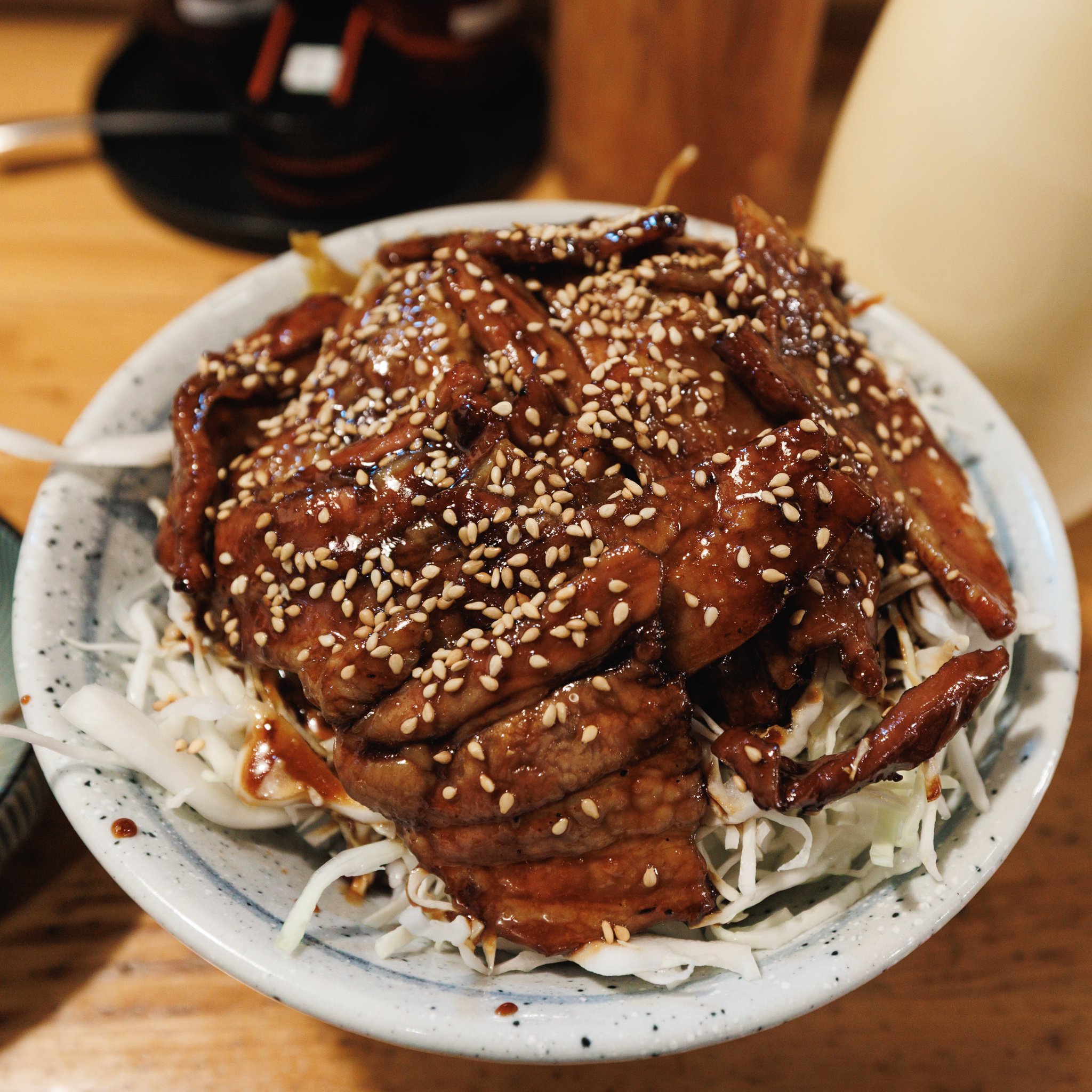 Tokumori bara-don at Sato no Udon in Fujisawa, with glazed pork belly and sesame seeds over shredded cabbage and rice.