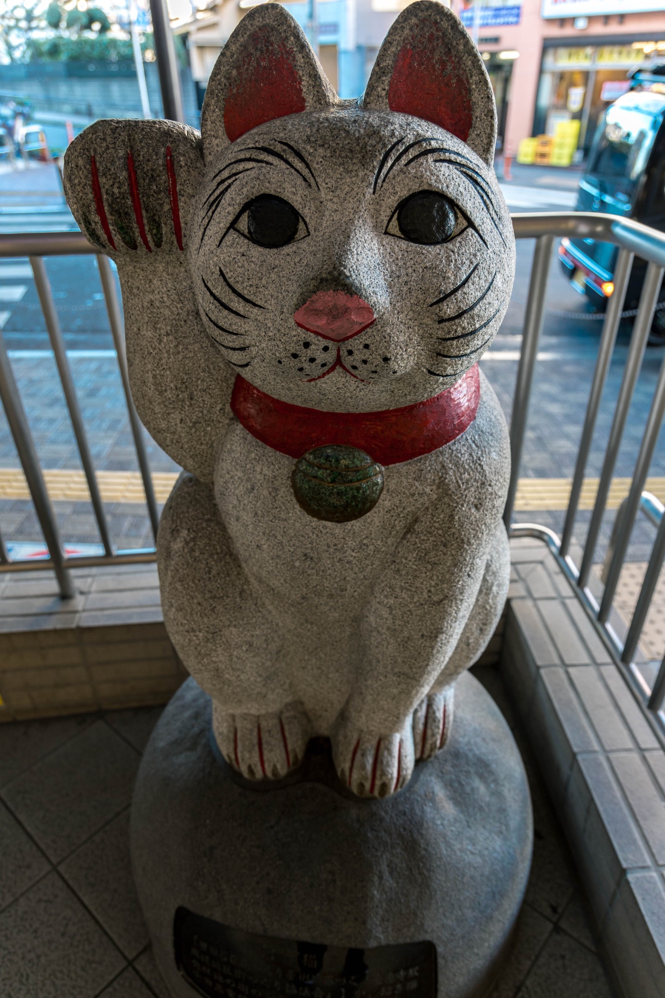Stone maneki-neko monument near Gotokuji Station in Tokyo.
