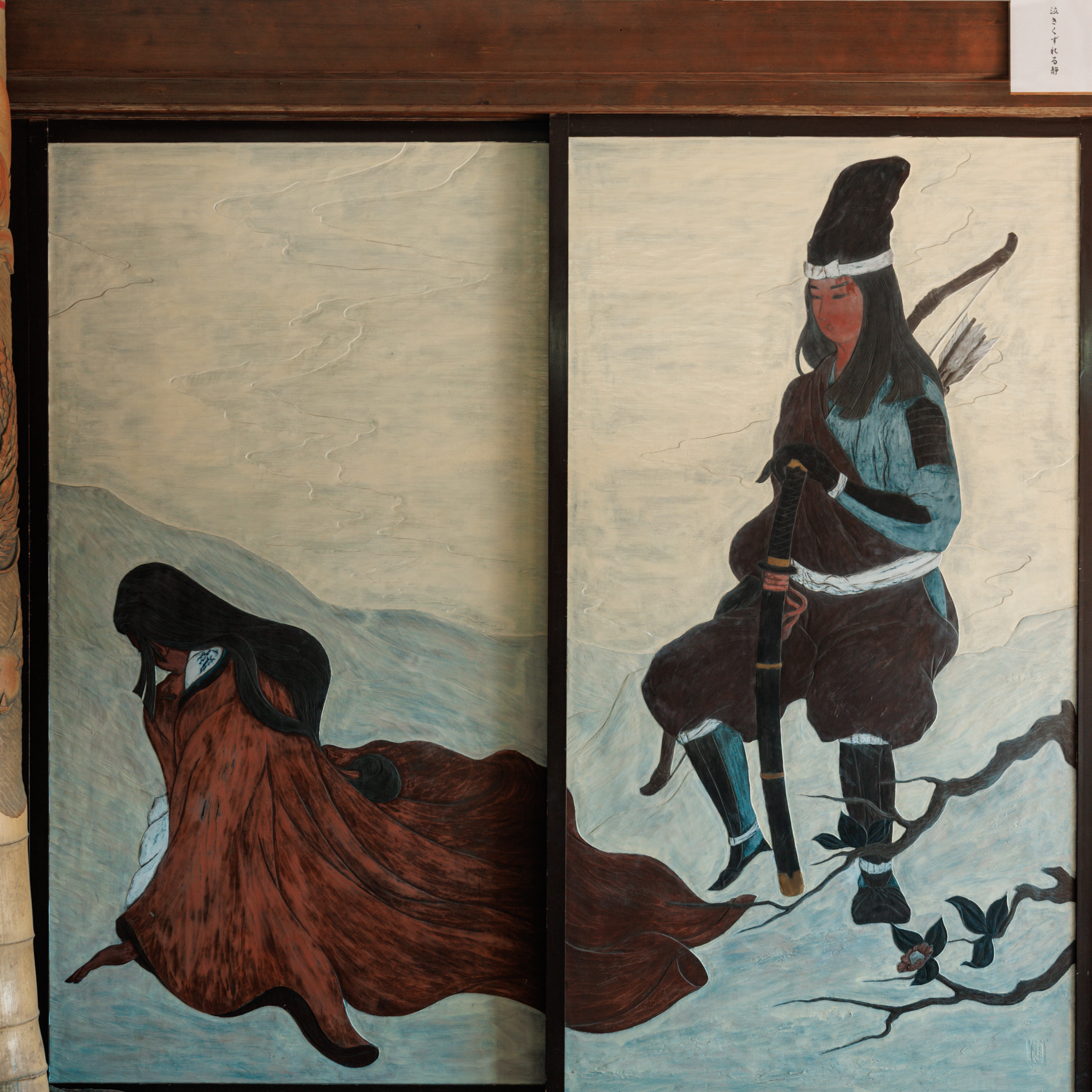 Two sliding doors on a pale blue ground, painted with a woman in a brown robe collapsed on the ground and a warrior with a bow and sword standing beside her
