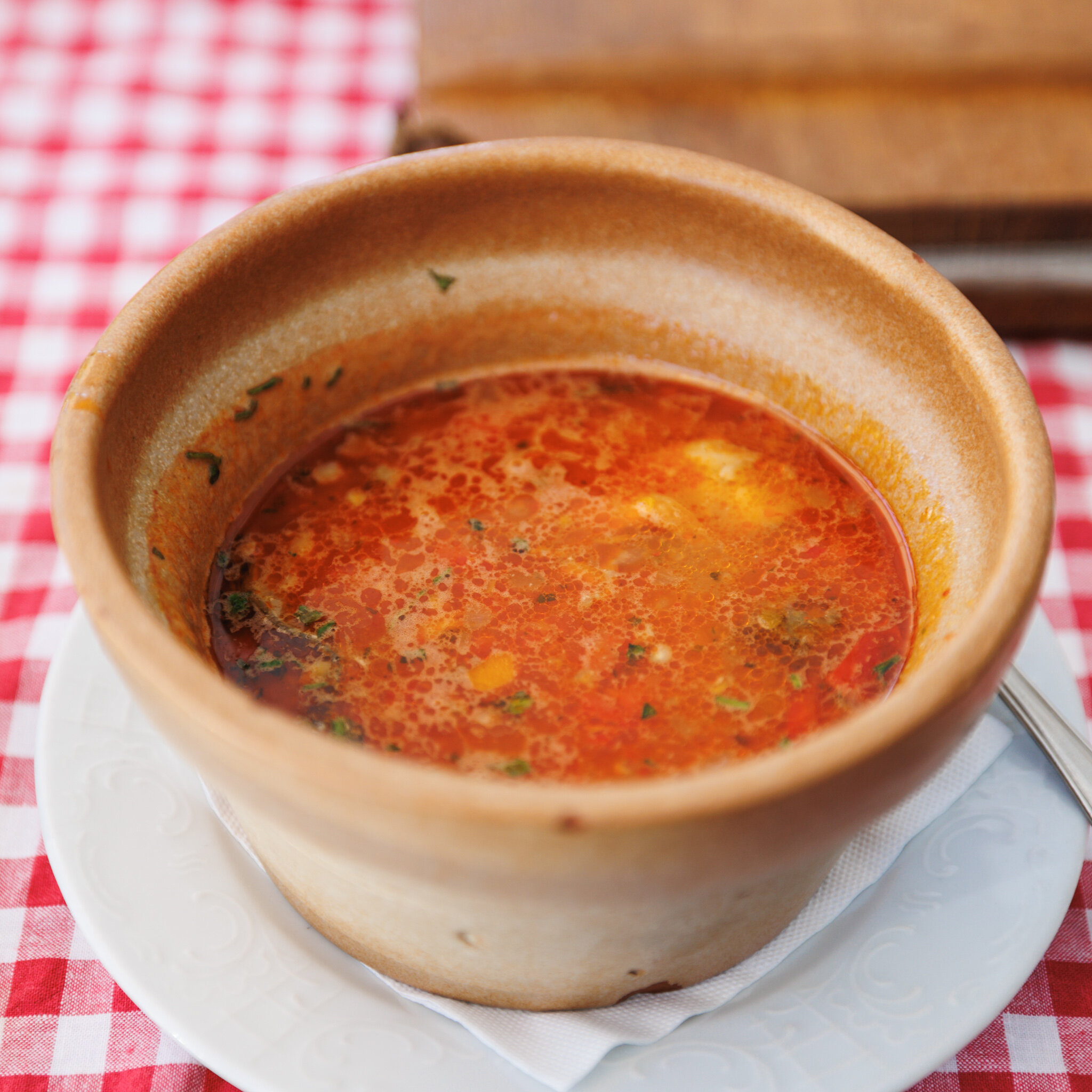 A bowl of riblja čorba, a Serbian river-fish soup, at Kafana “?” in Belgrade.