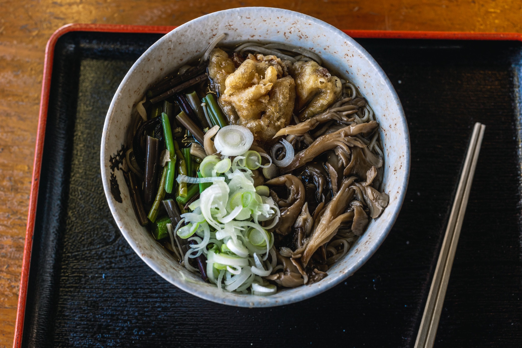 Sansai soba at Fukushimaya in Chichibu, topped with green mountain vegetables, mushrooms, spring onion and maitake tempura.