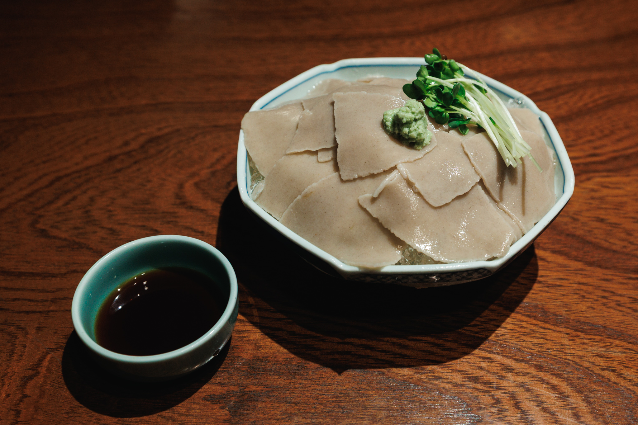 Thin sheets of soba over ice, topped with wasabi and radish sprouts at Minemoto in Kamakura.
