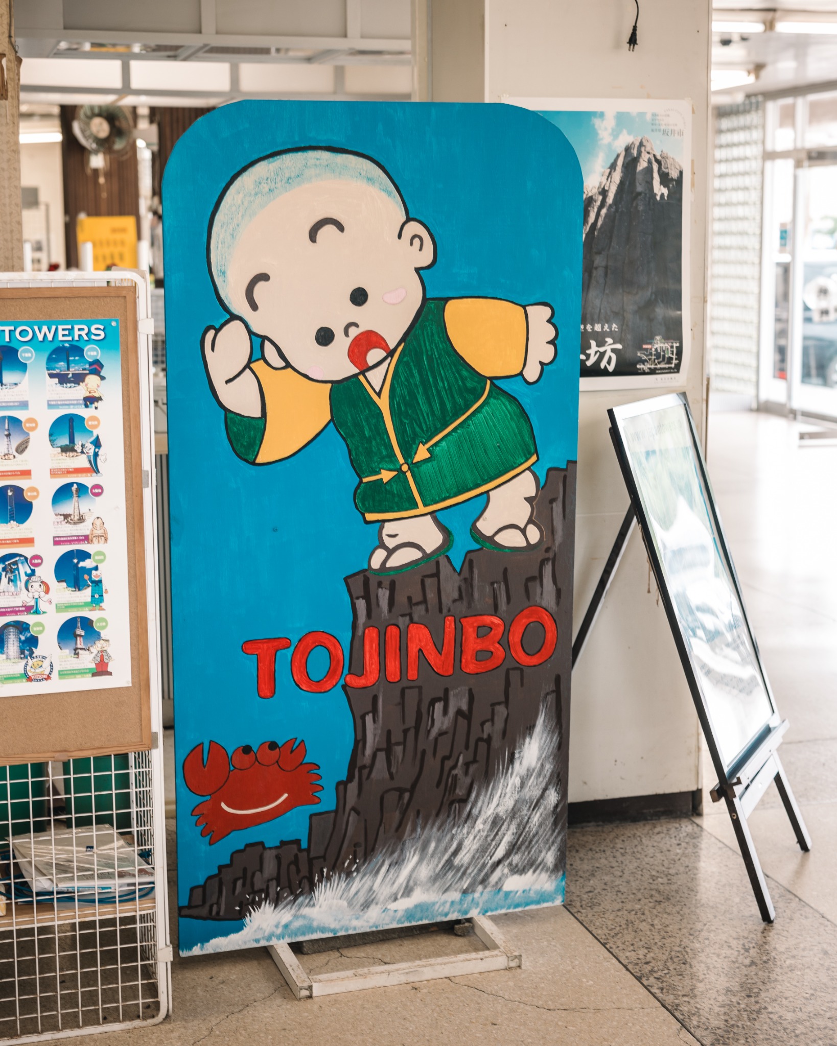 Hand-painted Tojinbo-themed sign inside the lower area of Tojinbo Tower.